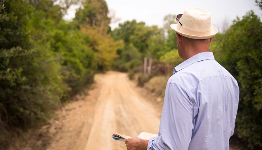 Tourist man try navigate himself with map  in unknown city