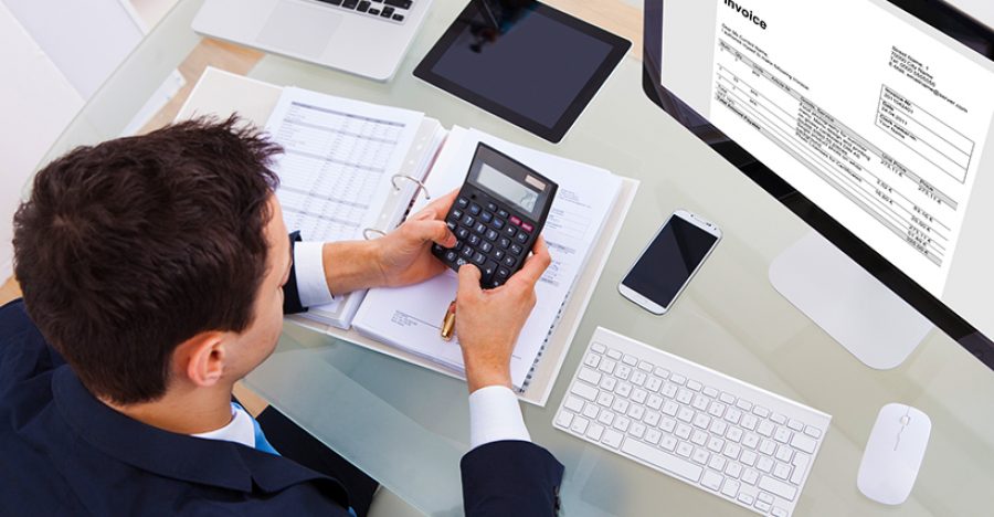 Businessman Calculating Tax