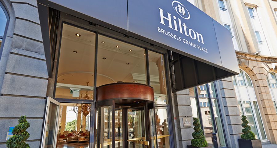 Glass revolving door at Hotel Hilton Grand Place