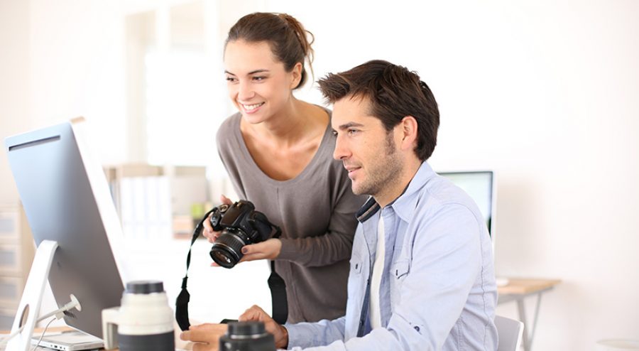 Photo reporters working in office