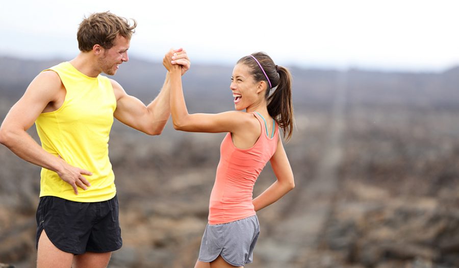 Fitness couple celebrating cheerful and happy