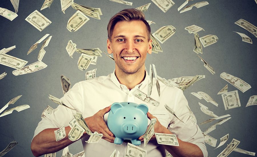 man with piggy bank under money rain falling down dollar bills