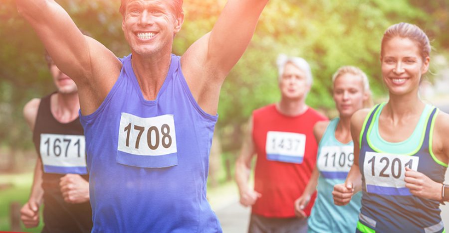 Marathon male athlete crossing the finish line