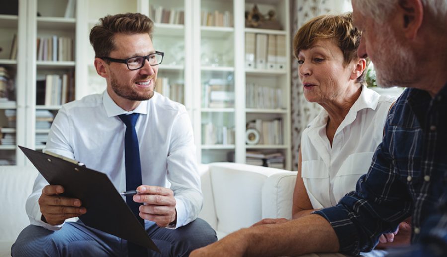 Senior couple planning their investments with financial advisor