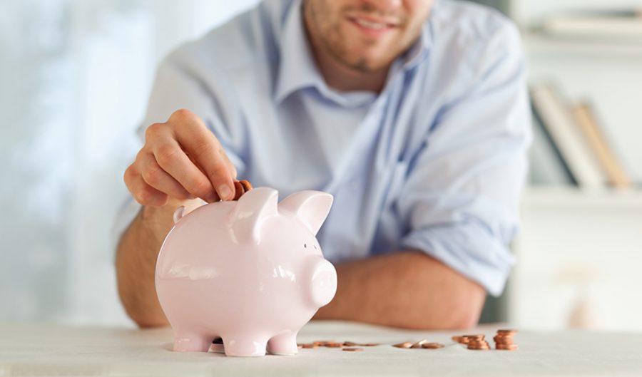 Change being put into piggy bank