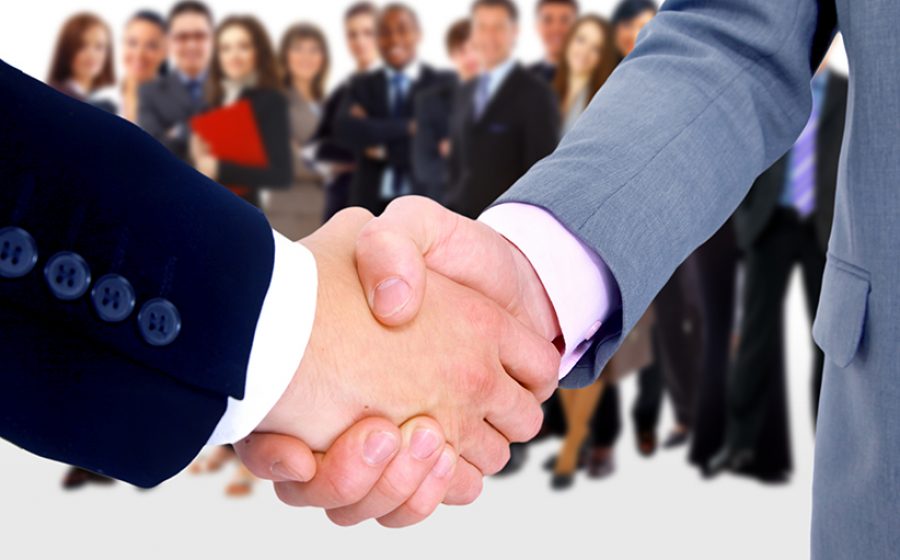 Handshake isolated on business background