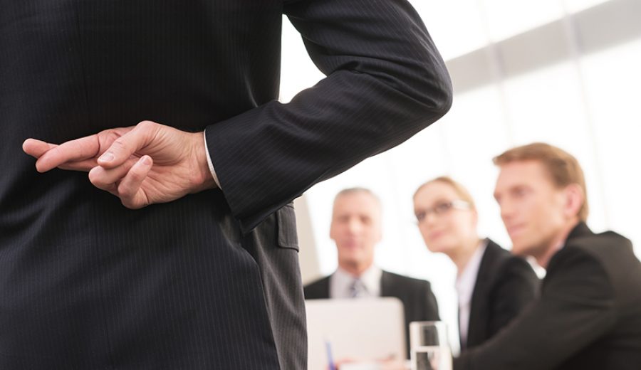 Lying? Rear view of man in formalwear keeping fingers crossed be