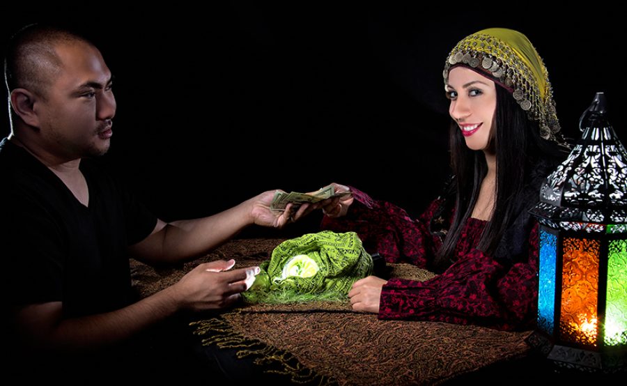 Swindler Gypsy Fortune Teller Committing Fraud