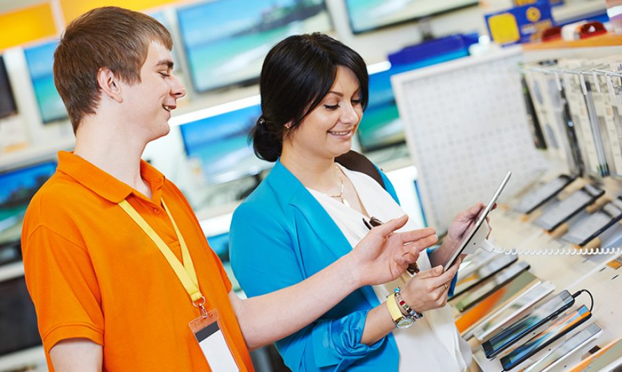 woman shopping at electronics supermarket