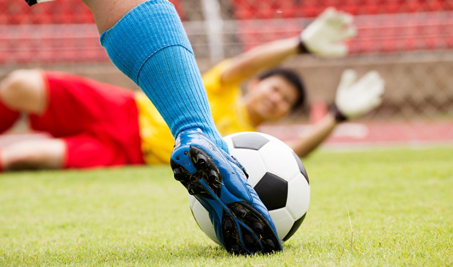 soccer player with ball before shooting