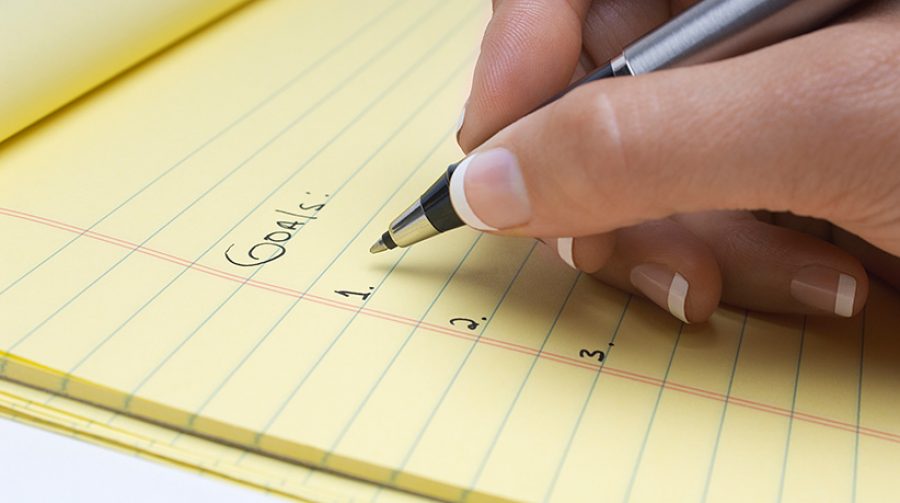 Writing Goals On Notepad