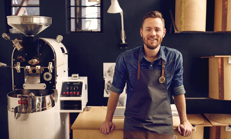 Entrepreneur in his modern coffee roastrery and distribution spa