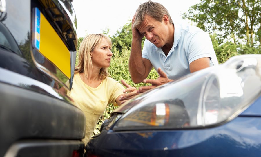 Man And Woman Having Argument After Traffic Accident