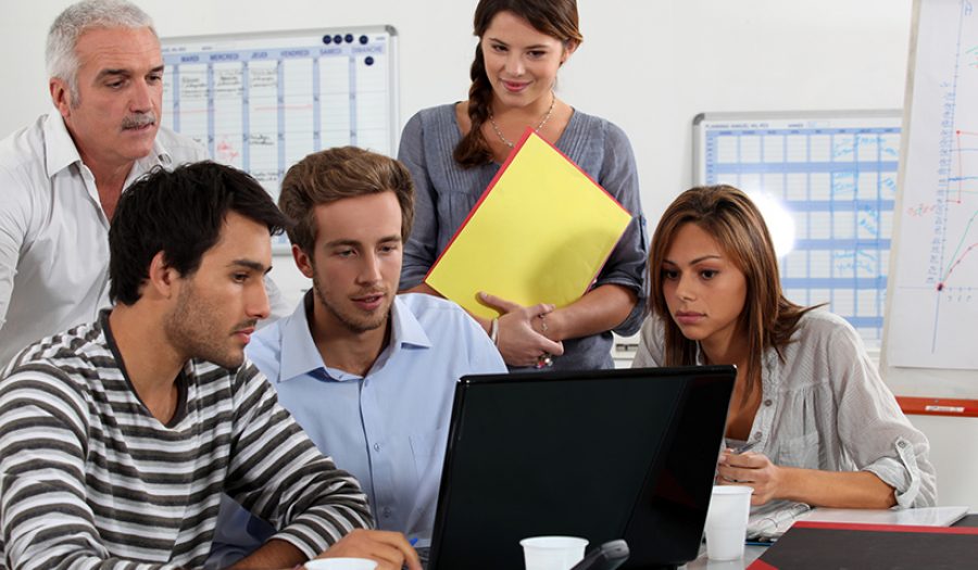 Young team working at a laptop
