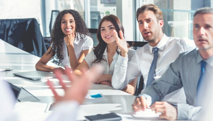 Group of people listening to a presentation.